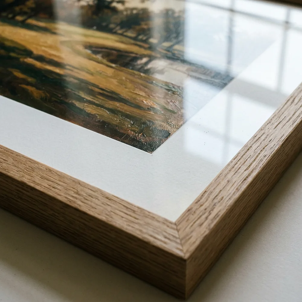 Mitred corner of a natural oak frame with white mount