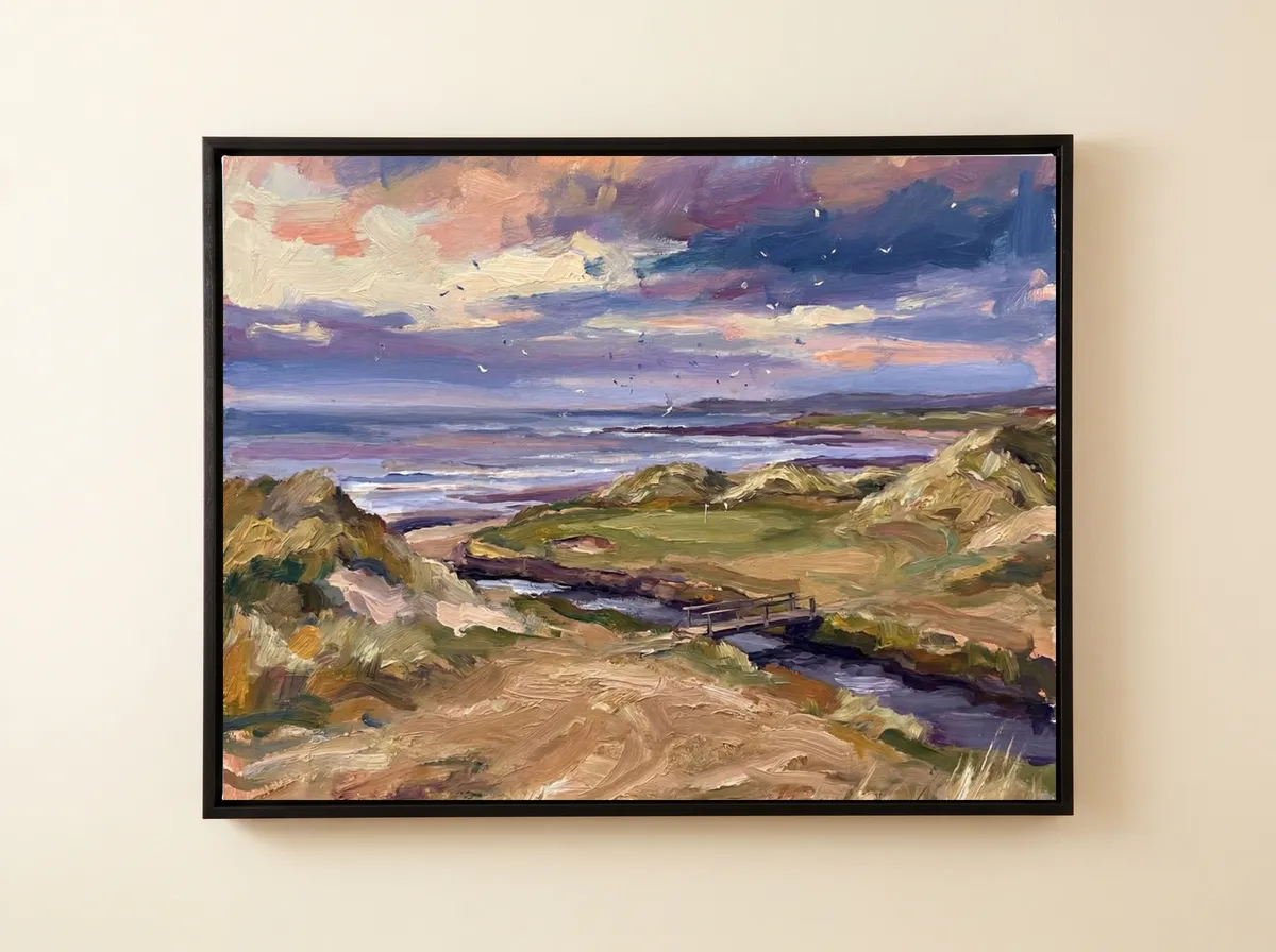 Links at Dusk on a black framed canvas, peach and violet clouds over a seaside course and a winding stream.