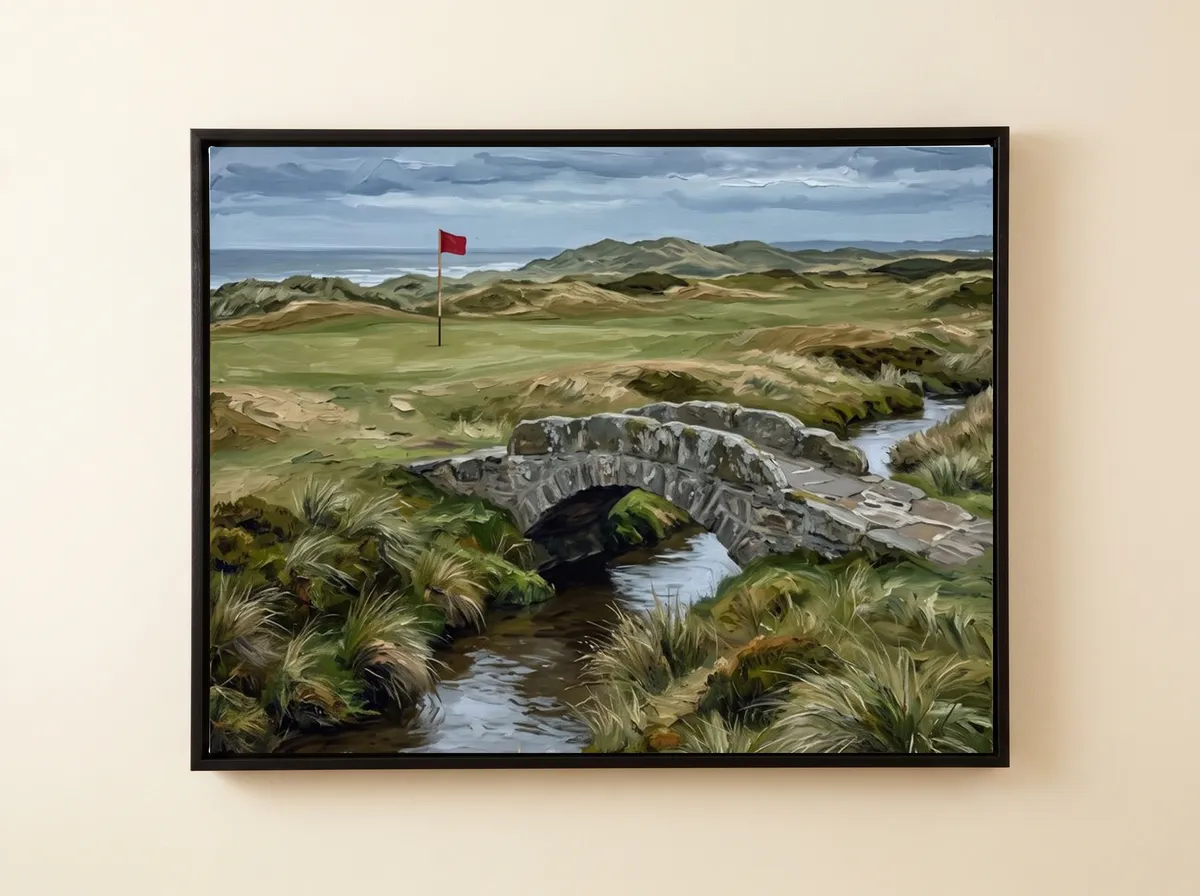 The Stone Crossing on a black framed canvas: a humped stone bridge over a dark stream with dunes beyond.